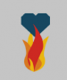 Black heart being burnt by red, orange, and yellow flames on a grey background